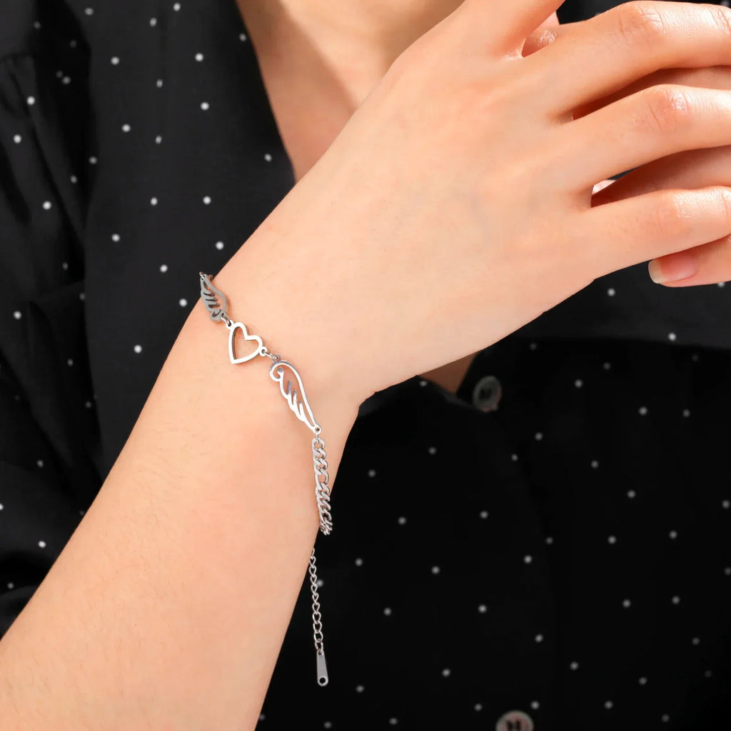 Silver heart and angel wings bracelet