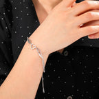 Silver heart and angel wings bracelet