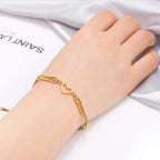 Gold heart and angel wings bracelet