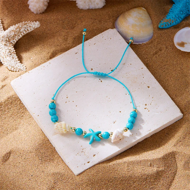 Cord bracelet with shell and blue starfish star