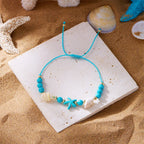 Cord bracelet with shell and blue starfish star