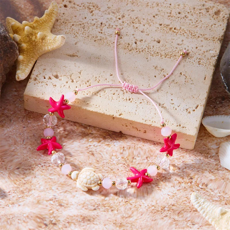 Cord bracelet with shell and red starfish turtle