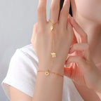 Hand and finger bracelet with Chai, Star of David and Hamsa protective Jewish pendants, gold star