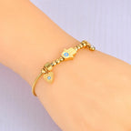 Protection Bracelet with Hand of Fatima and Blue Eye gold