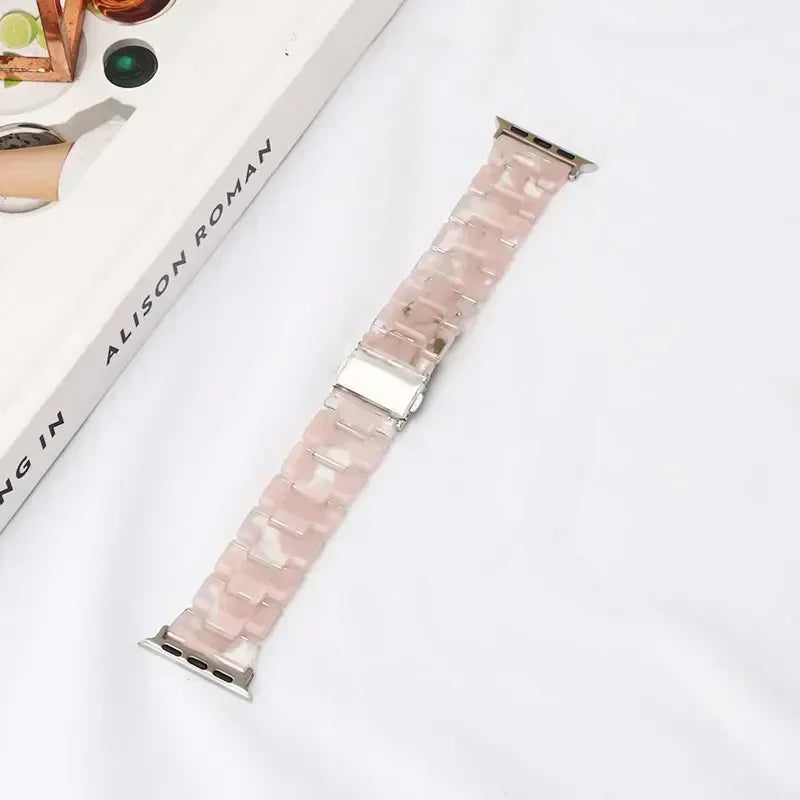 Replacement Apple Watch band in pink and white resin