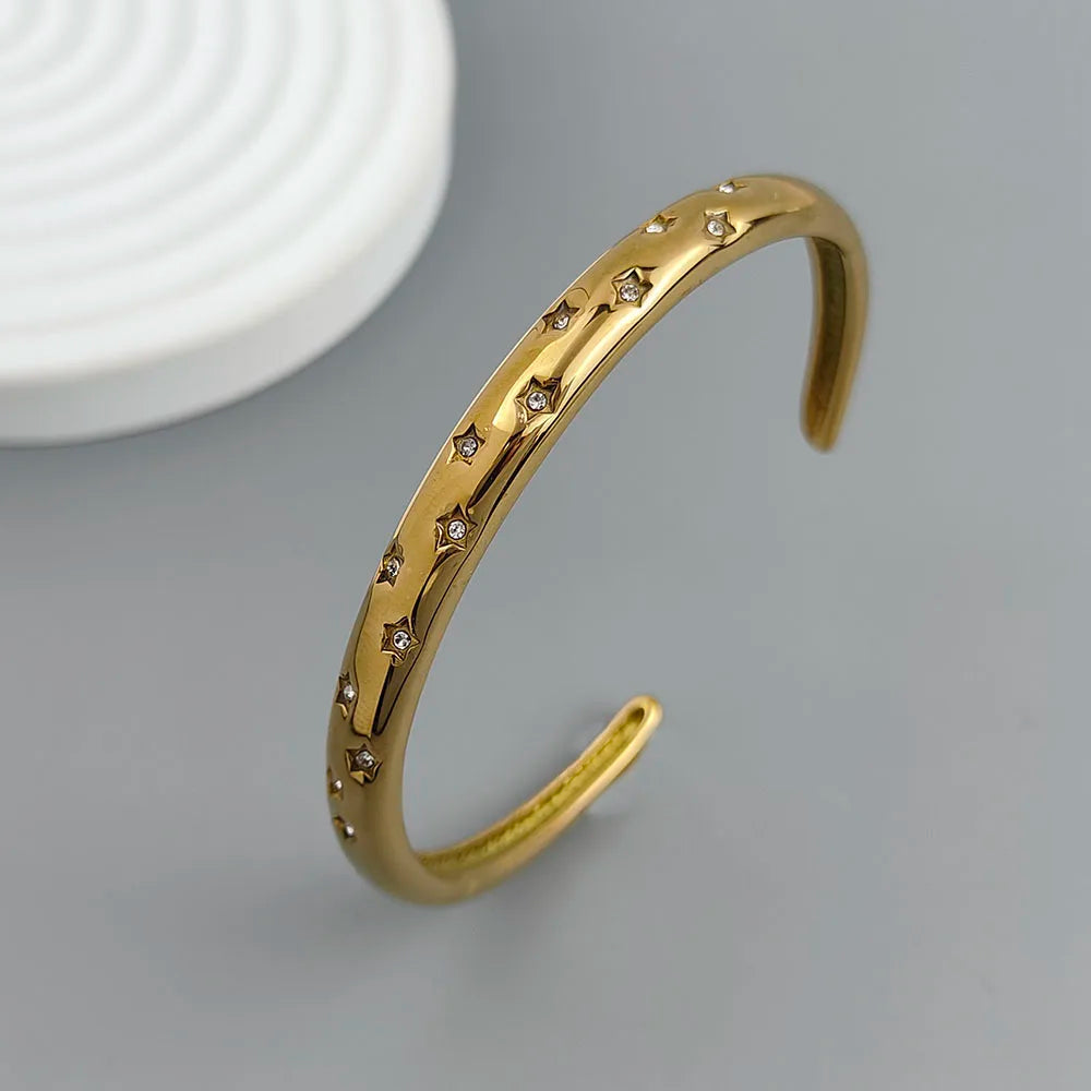 Elegant Bracelet with Gold Stars and Celestial Bodies