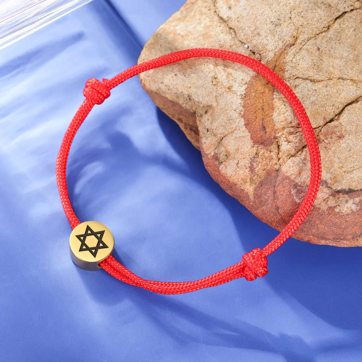 Rope bracelet with the Jewish symbol, the Star of David in red and gold