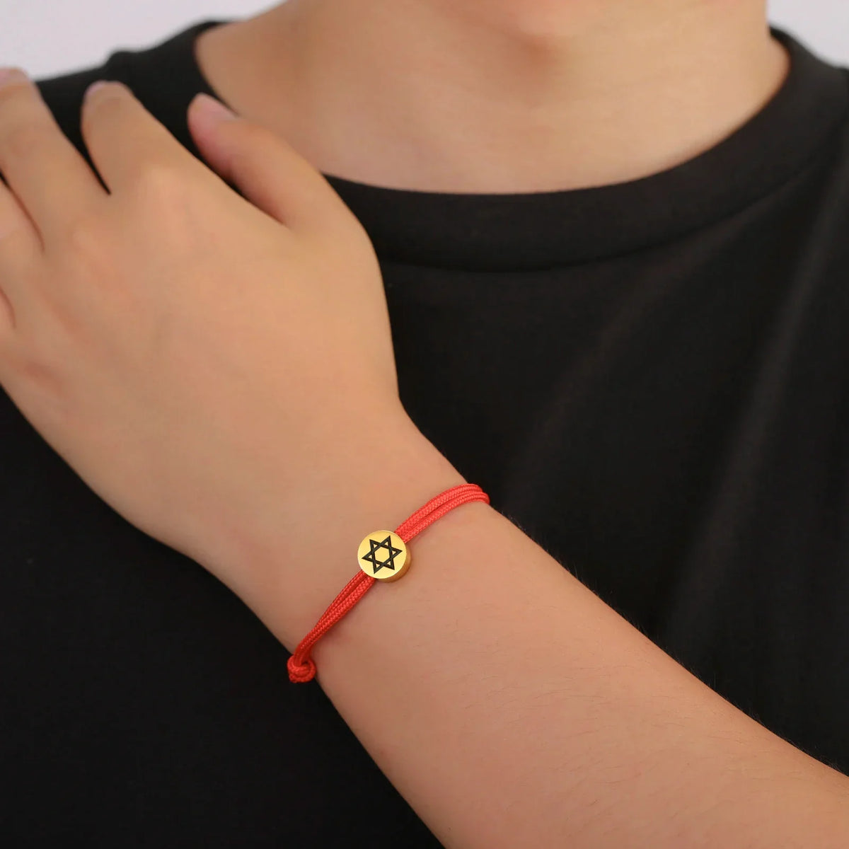 Rope bracelet with the Jewish symbol, the Star of David in red and gold