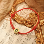 Rope bracelet with the Jewish symbol, the Star of David in red and gold