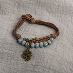 Cord Bracelet with 4-Leaf Clover and Blue Beads