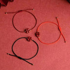 Cord Bracelet with Dark Red Cinnabar Four-Leaf Clover Stone