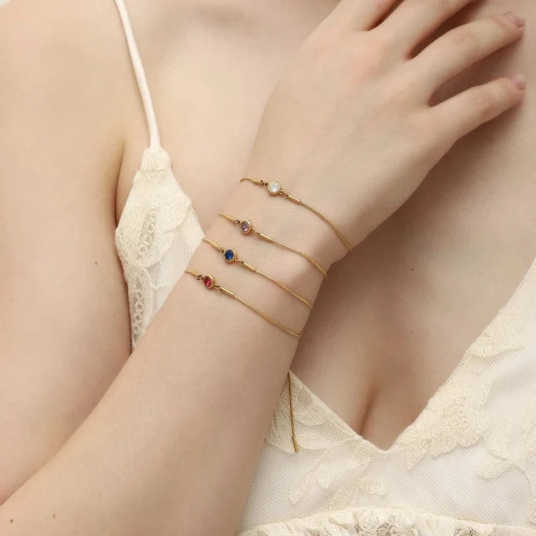 Bangle bracelet with colored birthstone