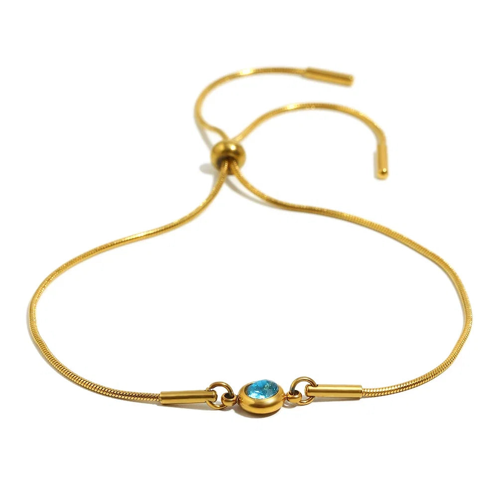 Bangle bracelet with colored birthstone