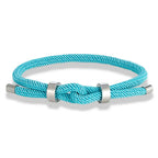 Modern braided cord bracelet with light blue knot