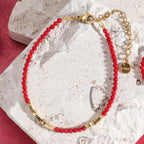 Coral red and gold bracelet
