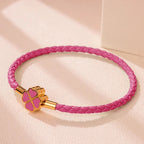 Braided Leather Bracelet with Four-Leaf Clover dark pink