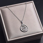 Necklace with large openwork spiral pendant in silver