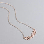 Necklace with large rose gold angel wings pendant