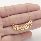Necklace with large rose gold angel wings pendant