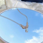 Necklace with angel wing pendant