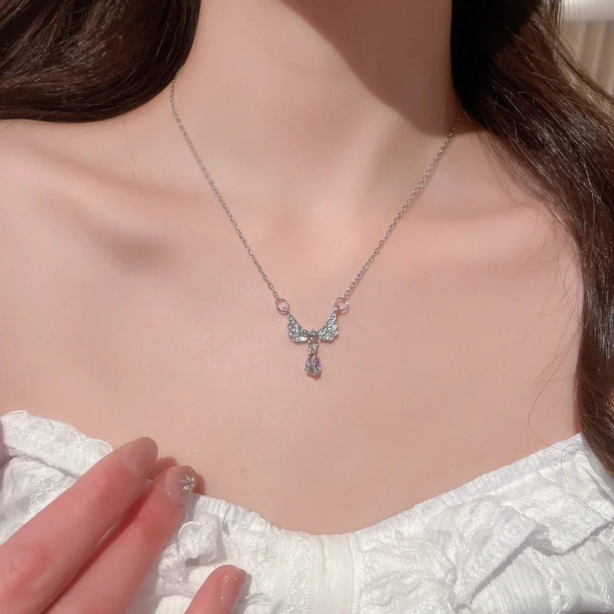 Necklace with angel wing pendant