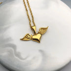 Necklace with angel wings and heart pendant