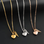 Urn necklace with angel wings and heart pendant in gold