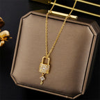 Necklace with key and lock pendant in gold