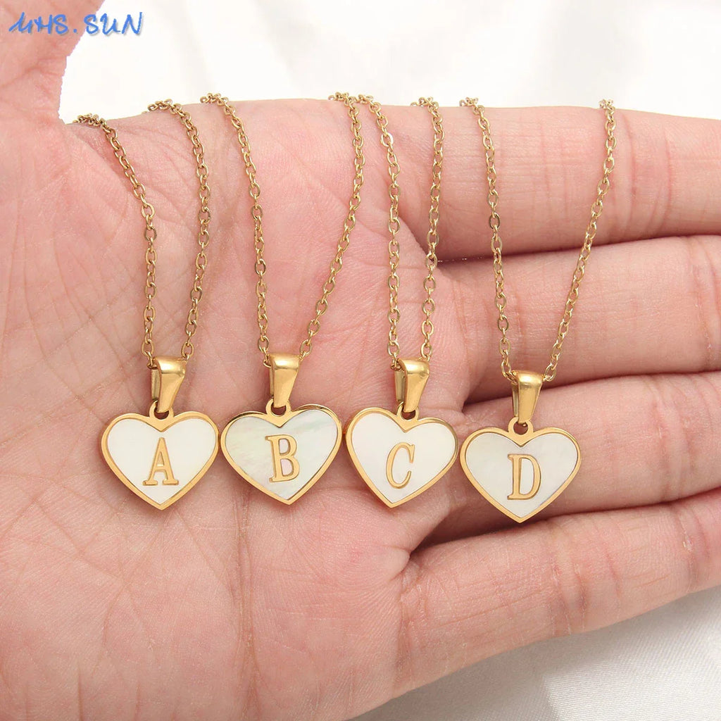 Necklace with white heart pendant initial