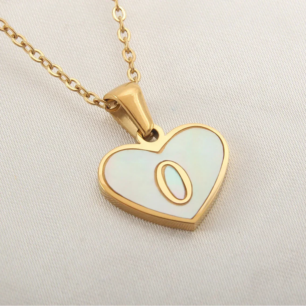 Necklace with white heart pendant initial o