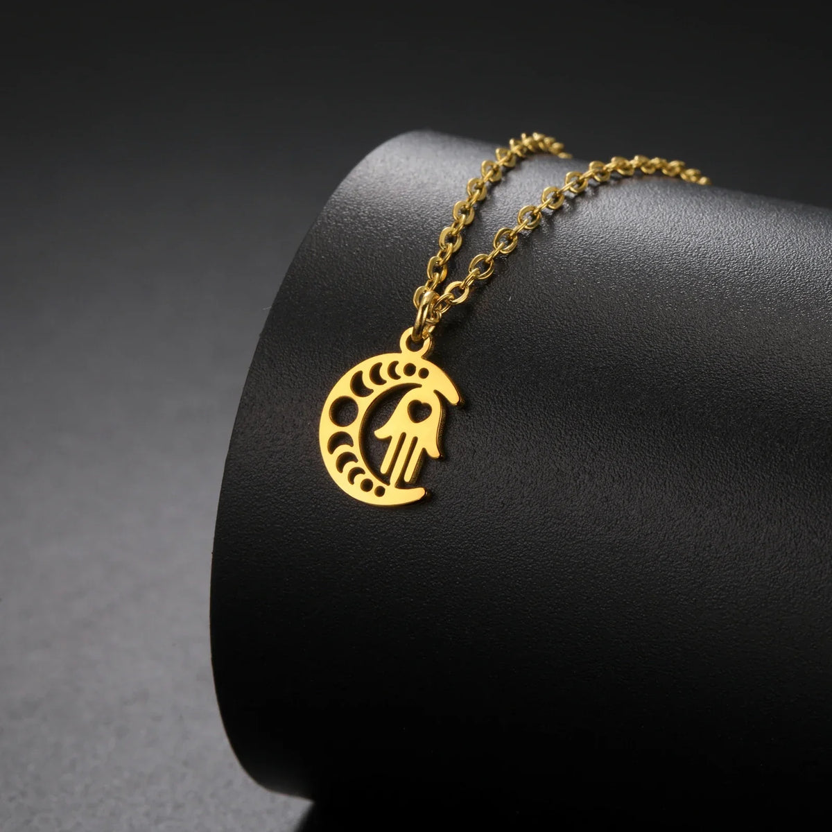 Necklace with Arabic Islamic crescent moon and Hamsa pendant in gold
