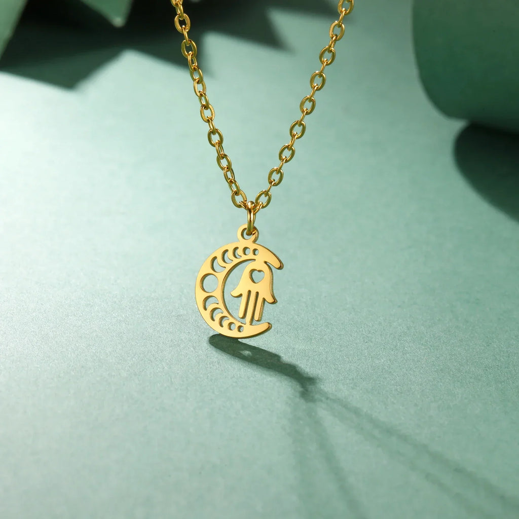 Necklace with Arabic Islamic crescent moon and Hamsa pendant in gold