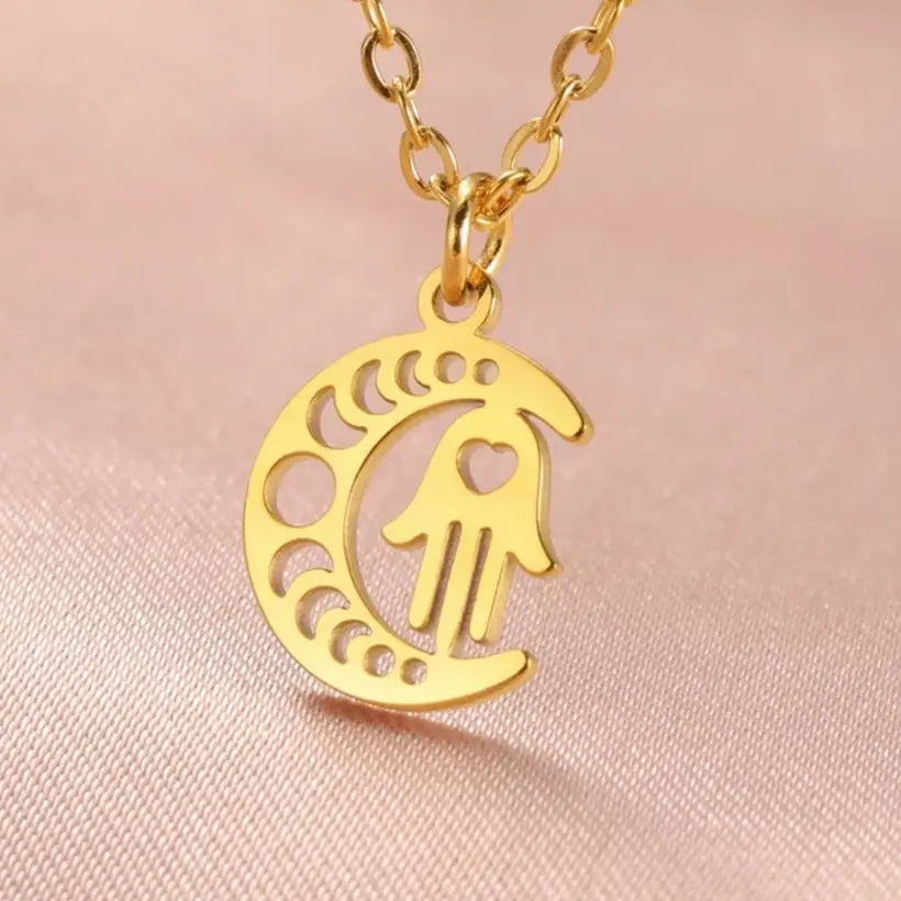 Necklace with Arabic Islamic crescent moon and Hamsa pendant in gold