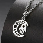 Necklace with Arabic Islamic crescent moon and Hamsa pendant in silver