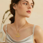 Necklace with pendant featuring the Star of David and symbolic Jewish fleur-de-lis in gold