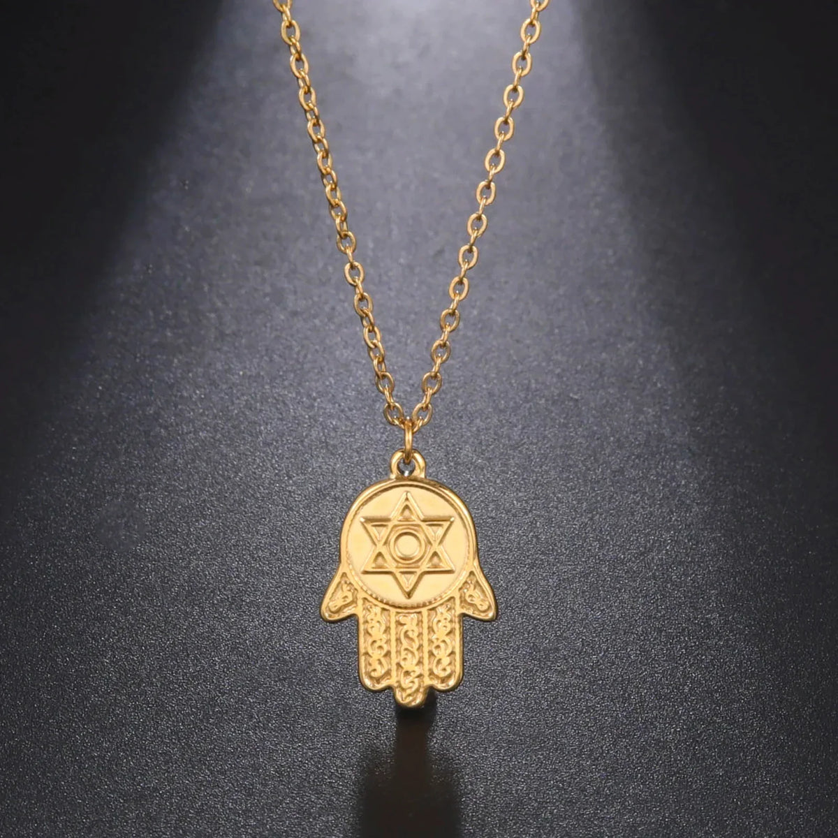 Necklace with protective pendant featuring the Star of David and Hamsa in gold