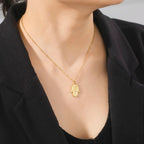 Necklace with protective pendant featuring the Star of David and Hamsa in gold