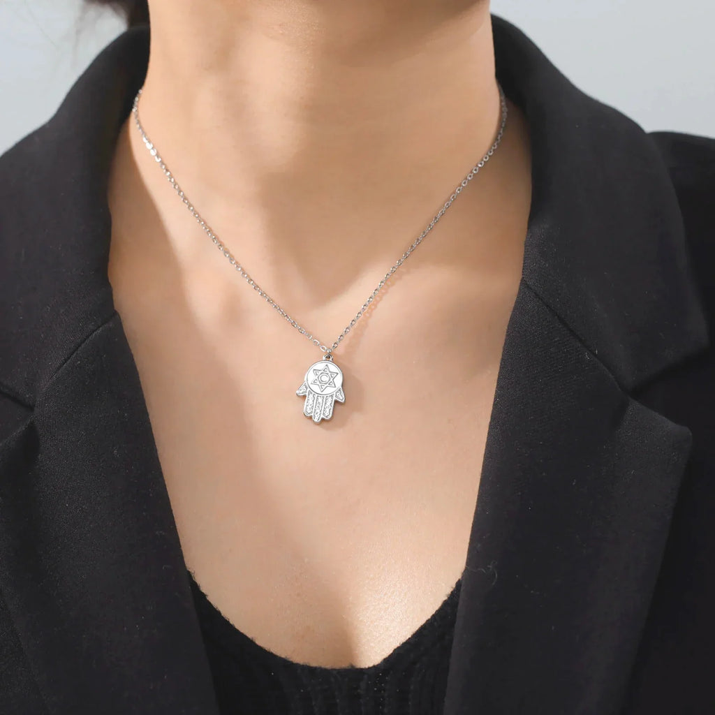Necklace with protective pendant featuring the Star of David and Hamsa in silver