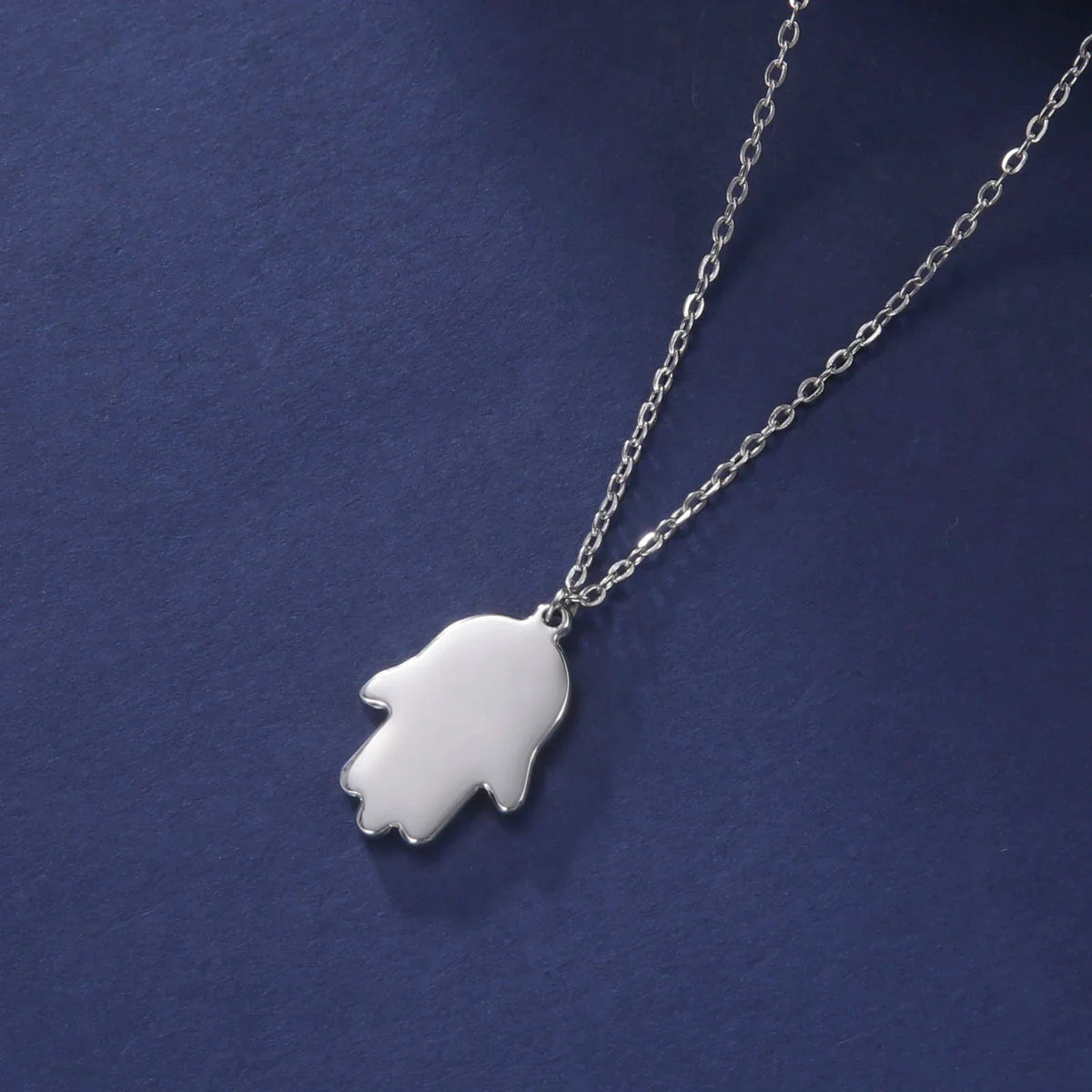 Necklace with protective pendant featuring the Star of David and Hamsa