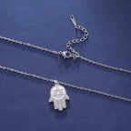 Necklace with protective pendant featuring the Star of David and Hamsa in silver