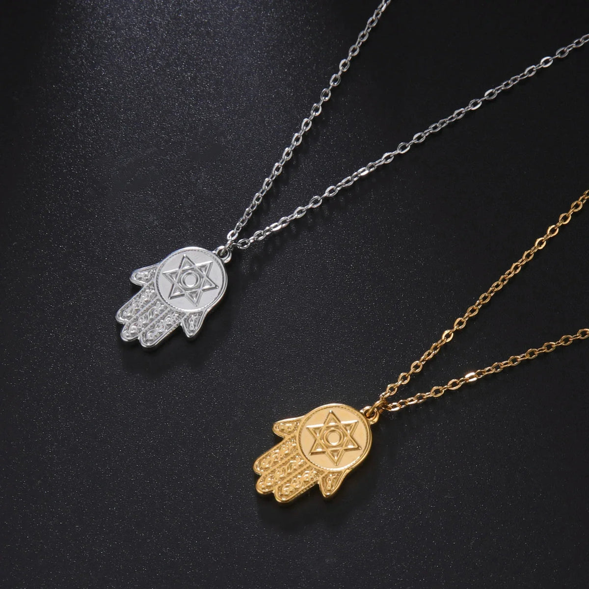 Necklace with protective pendant featuring the Star of David and Hamsa in gold