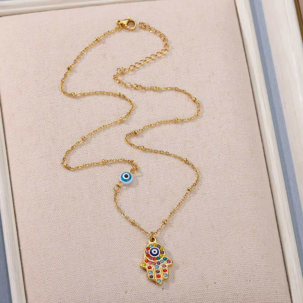 Necklace with multicolored Arabic evil eye and Fatima's hand protection pendant