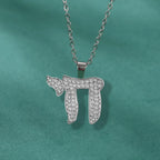 Necklace with crystal pendant of the Jewish symbol of life Chai in silver