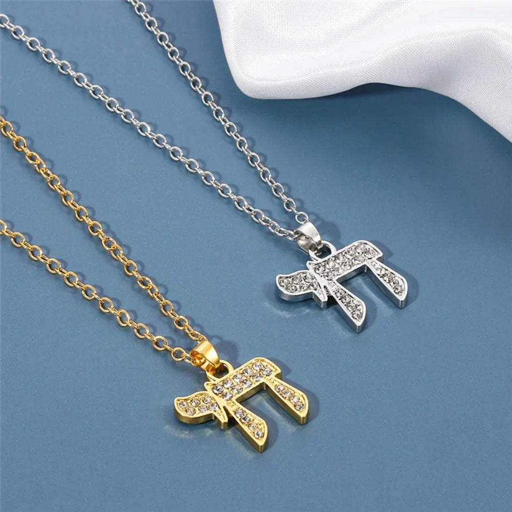 Necklace with crystal pendant of the Jewish symbol of life Chai in gold