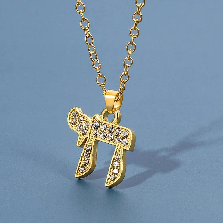 Necklace with crystal pendant of the Jewish symbol of life Chai in gold