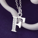 Long necklace with initial pendant f