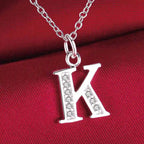 Long necklace with initial pendant k