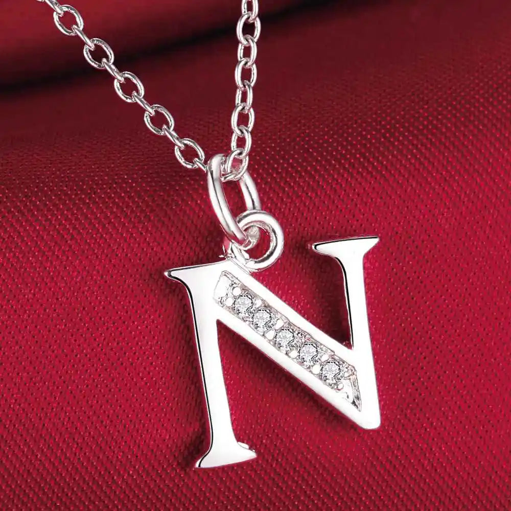 Long necklace with initial pendant n