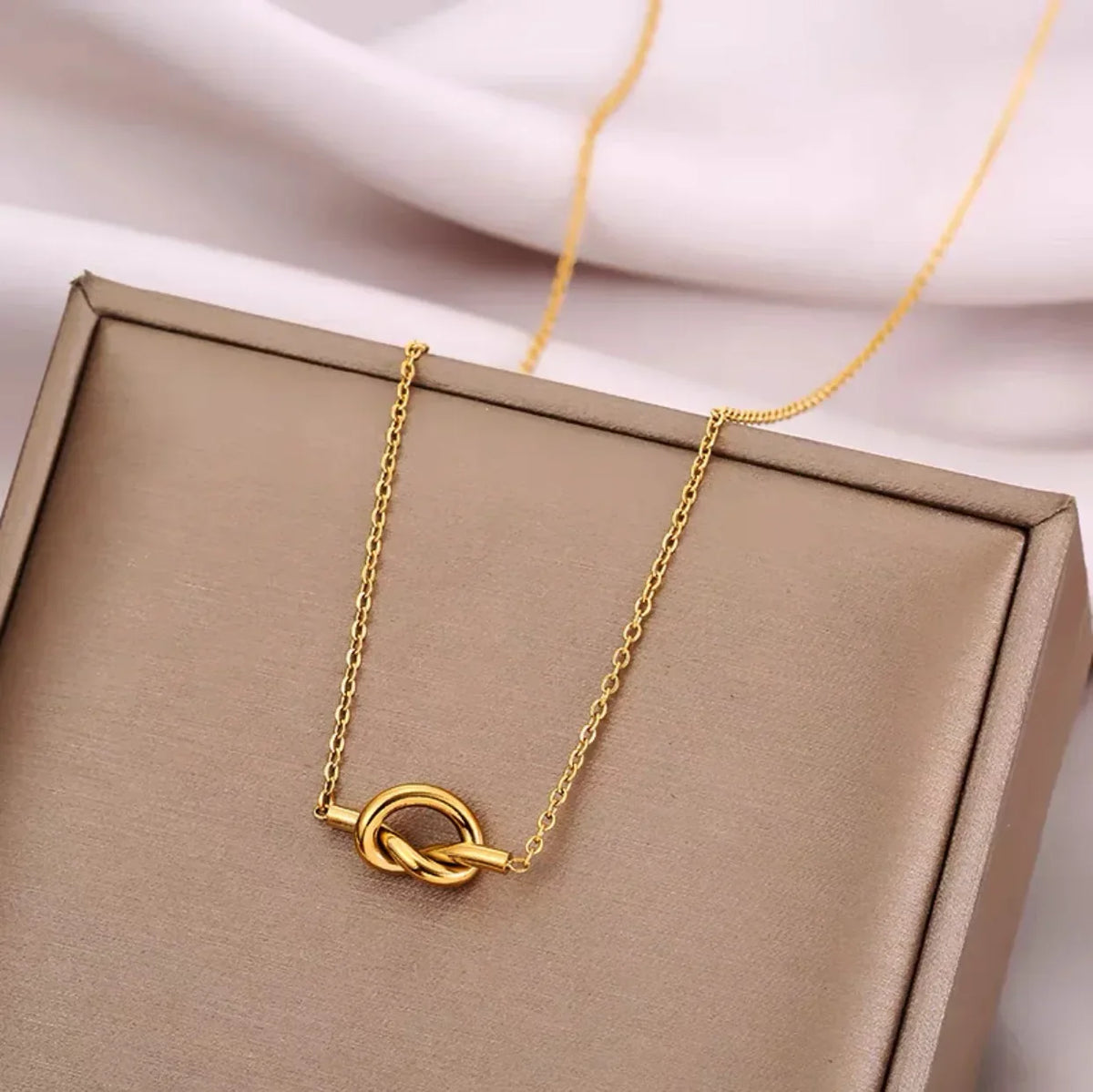 Necklace with a bow pendant for women
