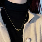 Necklace with a bow pendant for women